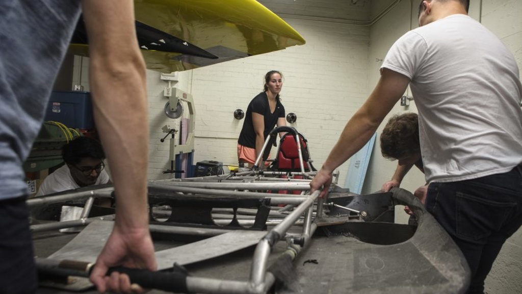 Students work on a solar car